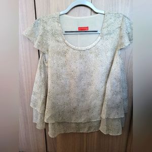 Beautiful breezy top with metal detail